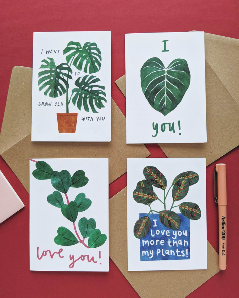 Four Valentine's Day cards featuring monstera deliciosa, philodendron, sweetheart plant and prayer plant paintings