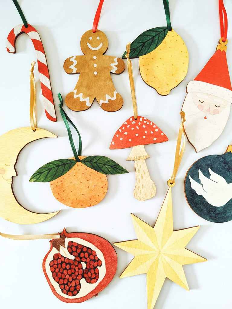 Candy cane, gingerbread man, lemon, santa, moon, clementine, toadstool, dove, pomegranate and star wooden hanging decorations
