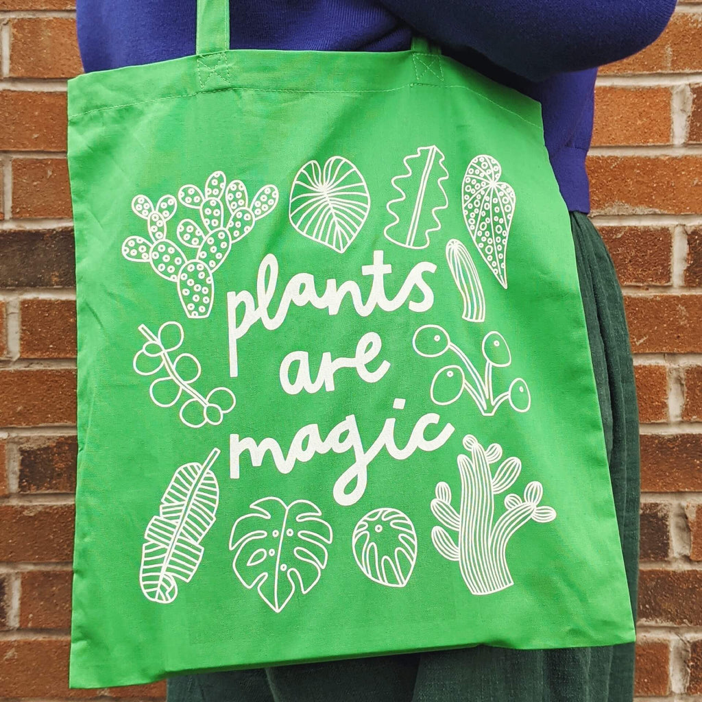 green tote bag with plants are magic design screenprint