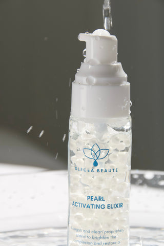 A bottle of Pearl Activating Elixir, a hyaluronic acid-based moisturizer for aging skin.