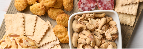 Image of crackers, nuts and more on a cheese board