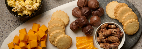 Image of chocolates and cookies on a cheese board