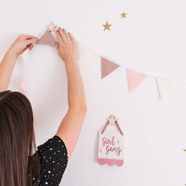 Star wall hooks are an easy way to hang bunting in your child's room.