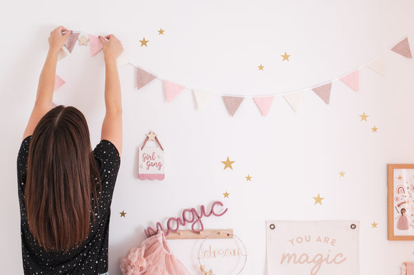 Hanging bunting in a girl's bedroom
