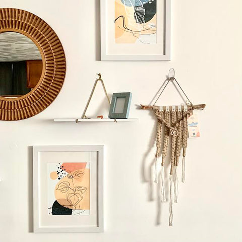 Gallery Wall with Mirror, Shelf, Two Art Prints, and a Macramé Wall Hanging 