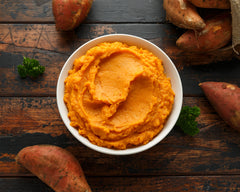 Mashed-Sweet-Potatoes-in-white-bowl-on-wooden-rustic-table.-Healthy-food-1186891829_1147x918