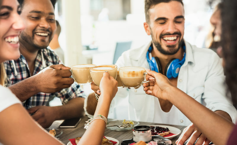 nespresso-coffee-pods-friends-group-drinking-latte-at-restaurant