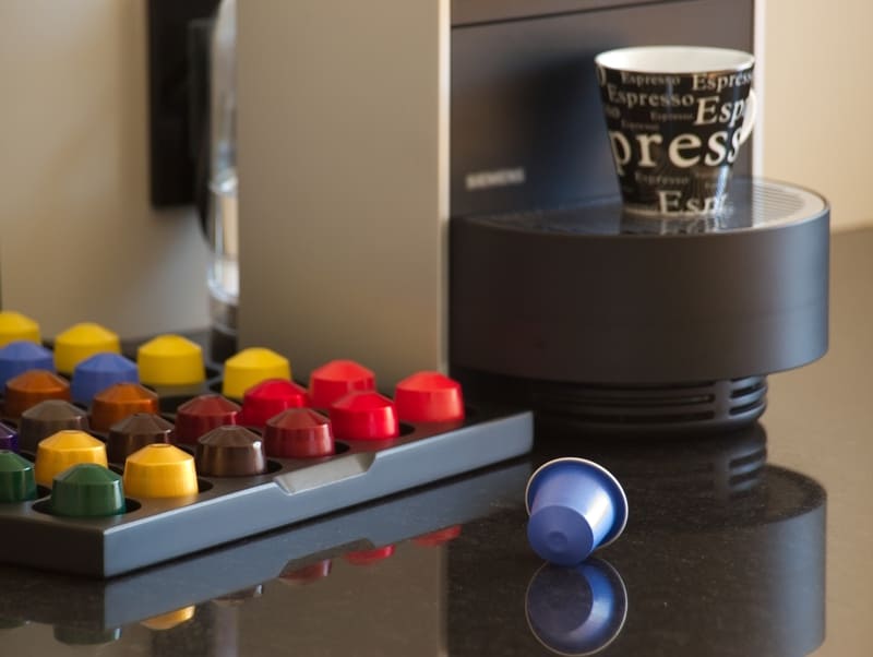 nespresso-coffee-pods-pods-and-machine-on-tabletop