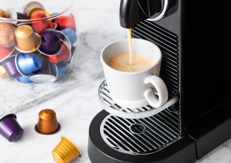 nespresso-coffee-pods-pouring-fresh-morning-coffee-with-espresso-machine-and-capsules