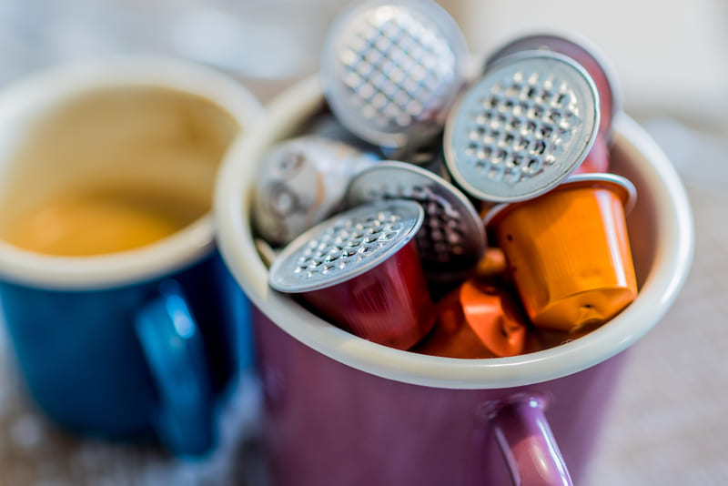 used-nespresso-coffee-pods-coffe-pods-in-enamel-mug