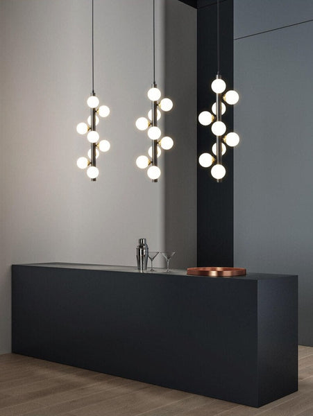 Luminate Living - Molekyl - Transform your living space into a modern, inviting ambiance with Molekyl's simple LED Chandelier. This sleek, contemporary design is perfect for any interior, from a grand staircase to a cozy bedroom. Its unique polished copper finish will add both style and illumination to any room in your home.