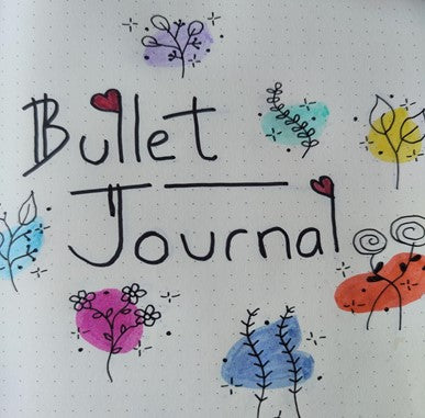 Colourful lettering 'bullet journal' and doodles - the first page of Ali's bullet journal