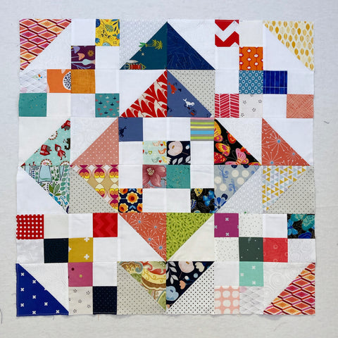Square Confetti Quilt by Penny Spool Quilts - charity baby quilt in multicolor on white background