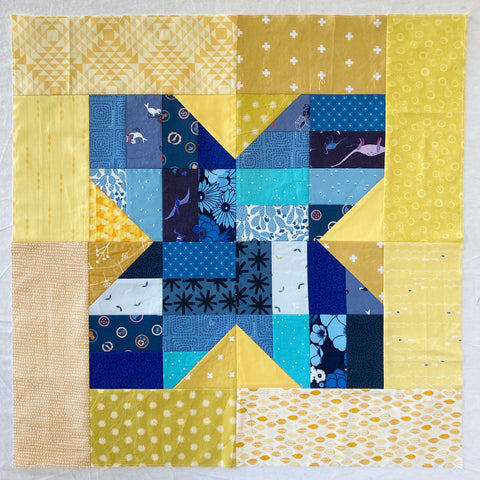 Dropzone X quilt block pattern in blue and yellow - Fun with Scraps