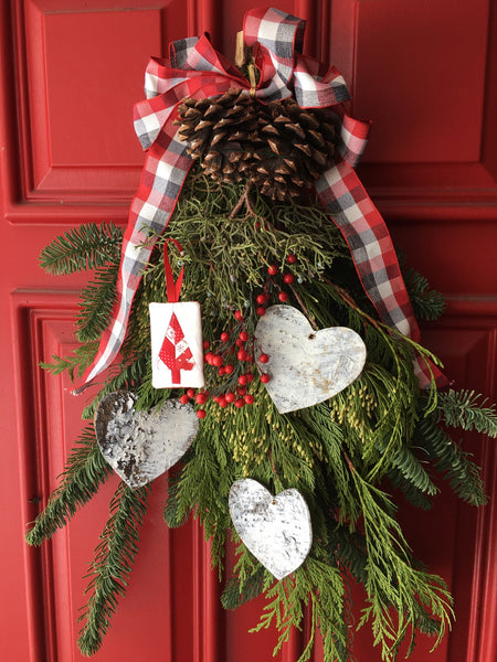 Festive Forest by Penny Spool Quilts - Christmas Tree Ornament Tutorial- showing the ornament hanging from a door swag decorated with birch hearts and plaid ribbon