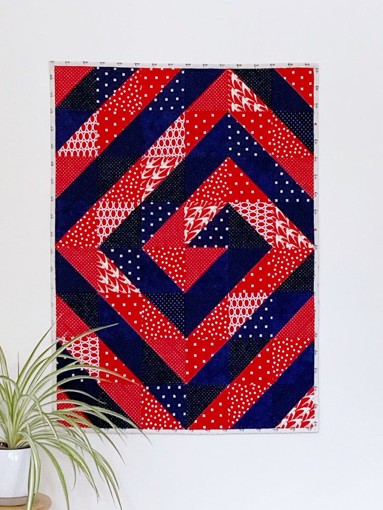 Ripple and Swirl Quilt pattern by Penny Spool Quilts, red and navy baby quilt