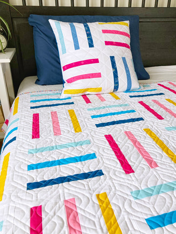 bar code quilt pattern by penny spool quilts - throw and pillow in multi on white