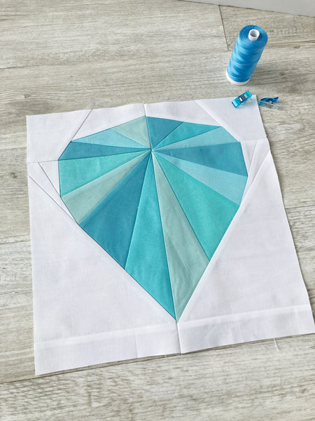 solitaire fpp quilt block sample in turquoise on white background