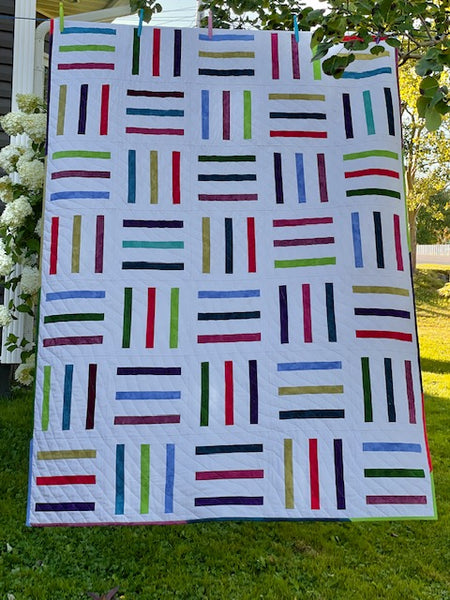 Bar Code quilt pattern by Penny Spool quilts - throw quilt with scrappy stripes on white background