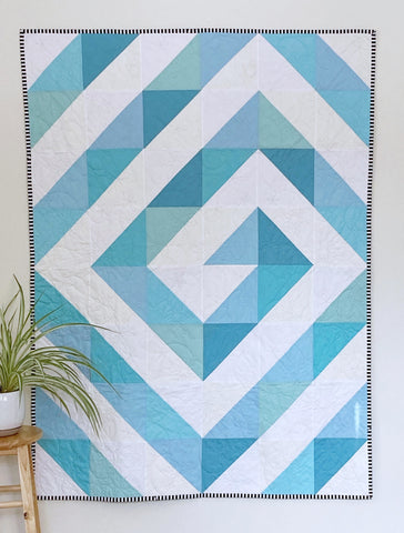 Ripple & Swirl HST quilt pattern by Penny Spool Quilts - sample shown is the Swirl layout in scrappy light blue on white