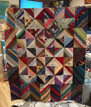 Scrap management blog series - how to make string quilts - a string quilt with mainly darker fabrics