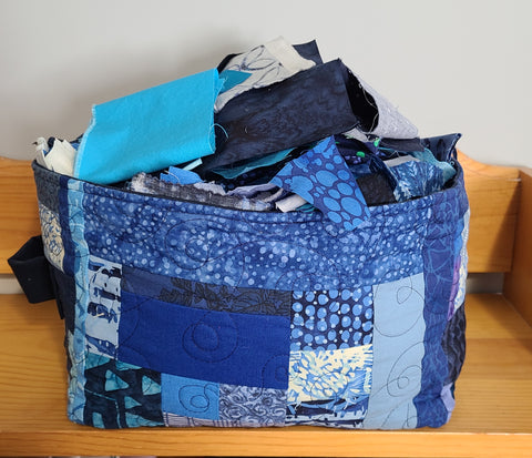 basket for storing fabric scraps, made of various blue fabric scraps