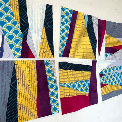 Scrap Management blog series, scrappy quilt blocks on a wall