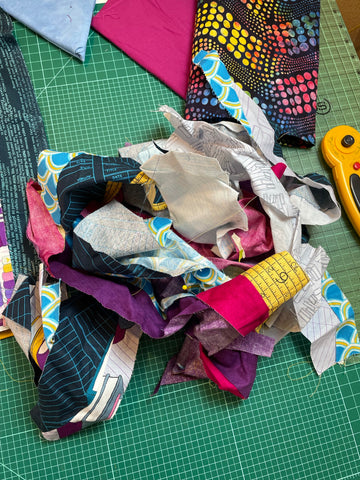 scrap management blog series, a pile of fabric scraps on a table