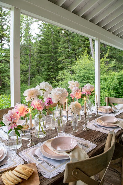 Glass bottles as vases for tablescape