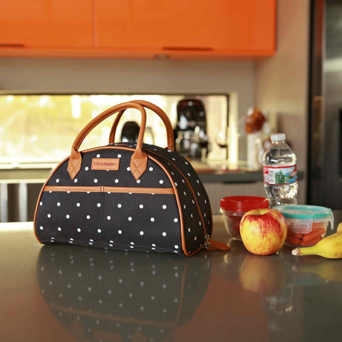There's a black polka dot lunch bag in the kitchen for the lady.