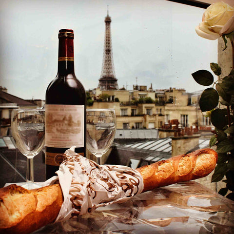 In France, a rooftop with wine and baguettes, sipping wine while gazing at French architecture in the distance