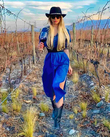 paoypavon wear a blue dress Walking through the vineyards with a glass of red wine in hand