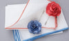 Rose and blue lapel flowers and pocket squares
