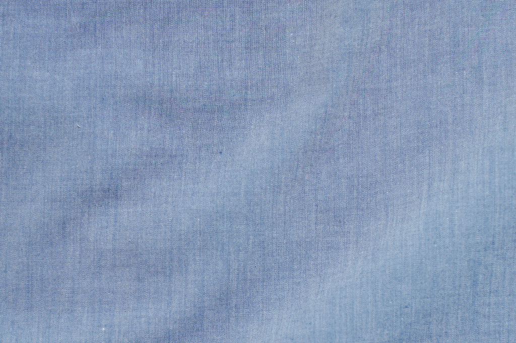 Chambray shirt fabric close up.