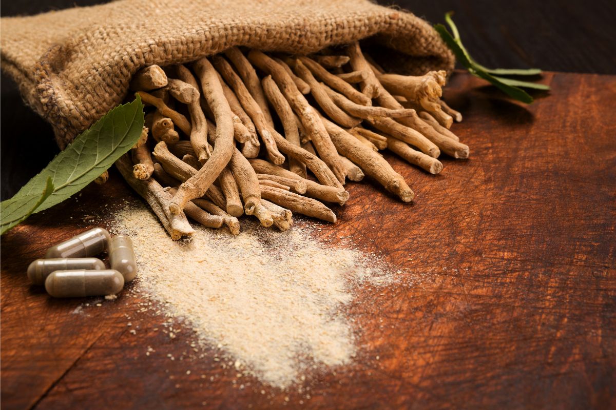 Brown bag with Ashwagandha root, powder and capsules.