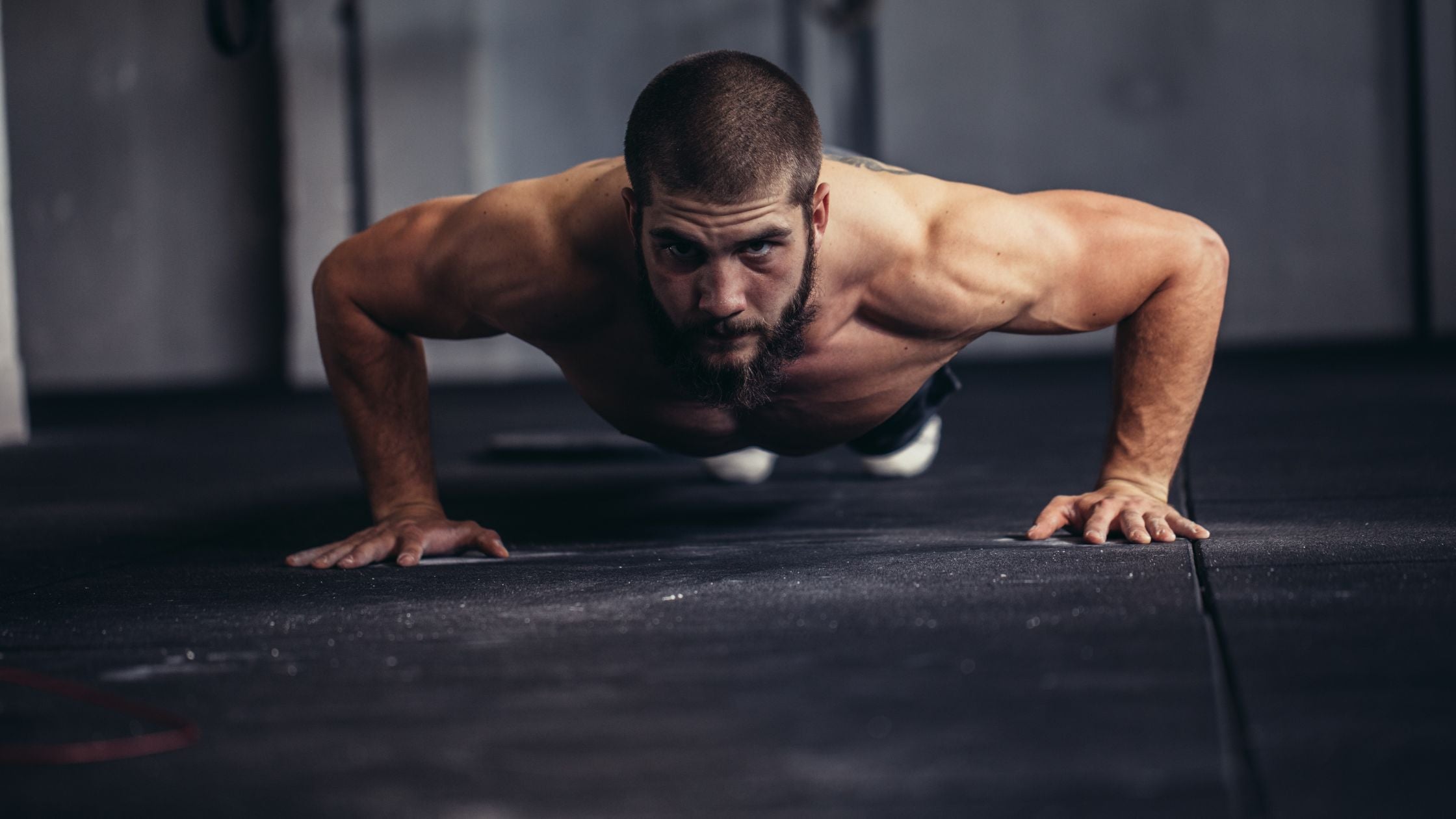 Bodybuilder doing pushup.