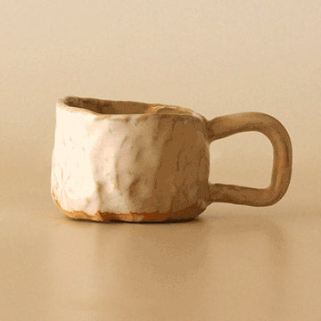 Glazed and fired clay mug