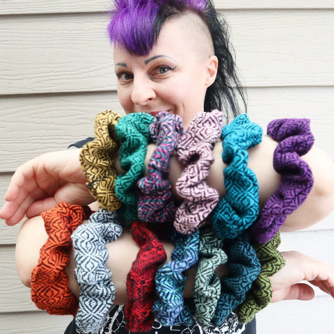 goth girl with purple mohawk with handwoven scrunchies on her arms