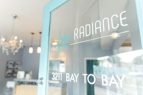 Image of Skin Radiance Welcome sign and door into medical spa