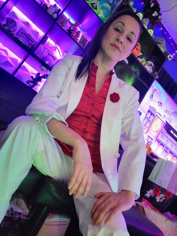 Marlayna Sereya in a white suit and red shirt