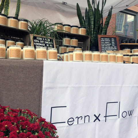 Fern x Flow soy candle company October market display in Salem, MA.