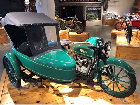 motorcycle with side-car displayed at museum