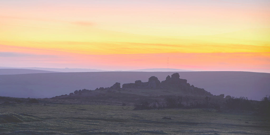 The sunsets over Dartmoor bonehill rocks