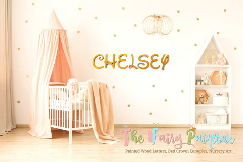 Gold Wall Letters on Baby Room Wall with Crib and Baby Bookcase