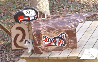 Pacific Northwest Native American eagle art style wood carved mailbox with native wolf design on side, painted black, red, white, and brown.