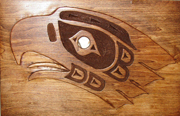 Pacific Northwest Native American eagle art style wood carving project, eagle relief carving in wood with abalone shell for eye. 