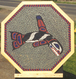 Glass mosaic tabletop with Pacific Northwest Native American orca art style design.