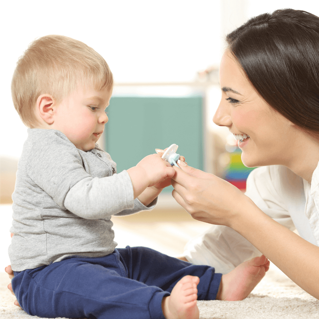 mom with baby and pacifier 