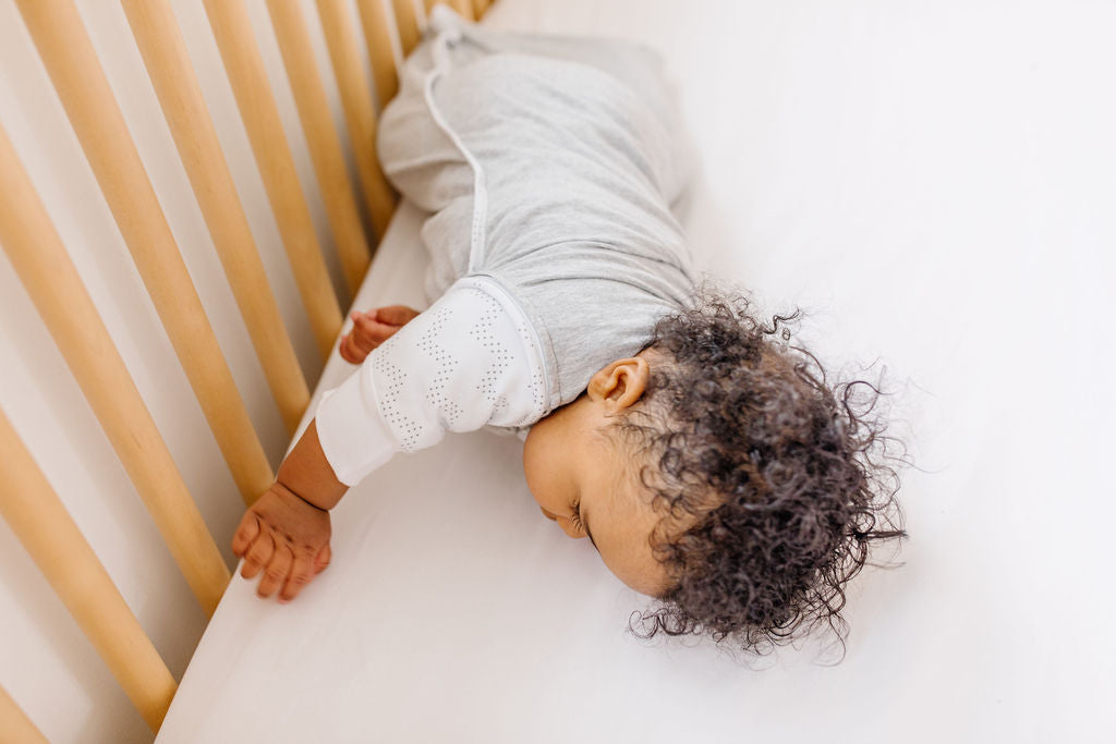 baby rolling over in crib