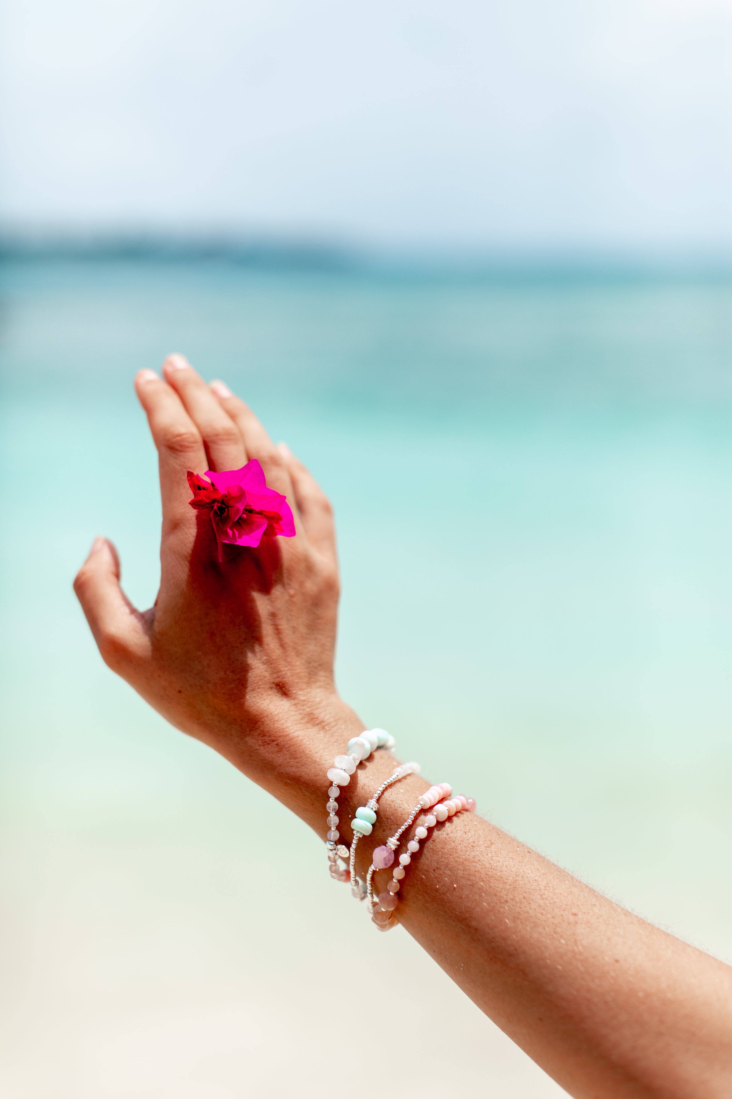 Crystal Bracelet wristwear feat. a pink flower at the beach - Cassie Louise Designs WANDERLUST